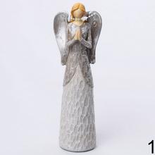 Dekoračný anjel so strieborným glitrom.