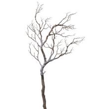 Umělá vánoční větev s bílými větvemi.