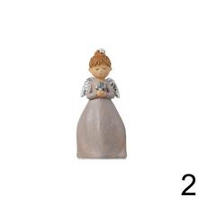 Súprava troch dekoratívnych anjelov s knihou, sviečkou a krížom.