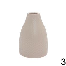 Keramická váza v mixe farieb, výška 14 cm.