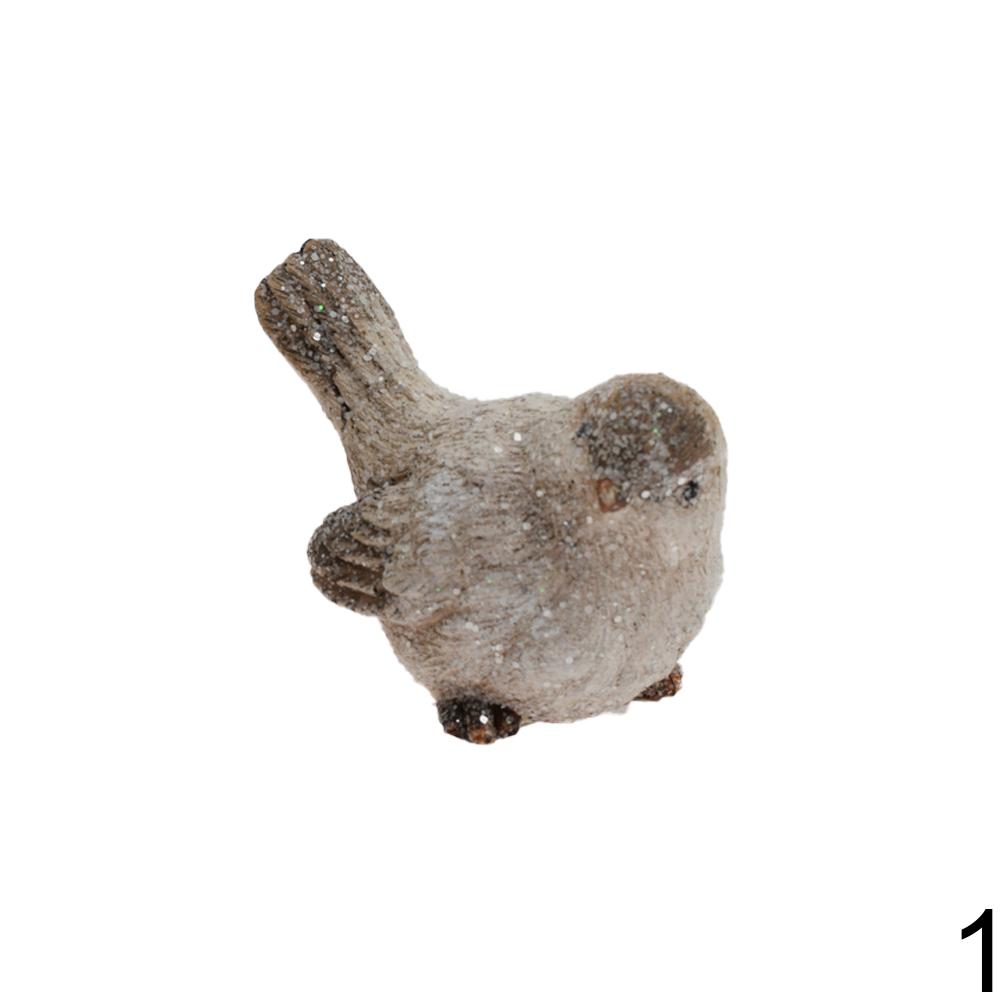 Keramické figurky ptáčků v bílé a zelené barvě.