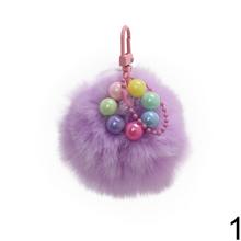 Prívesok chlpáč v rôznych farbách s guľôčkami.