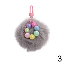 Prívesok chlpáč v rôznych farbách s guľôčkami.