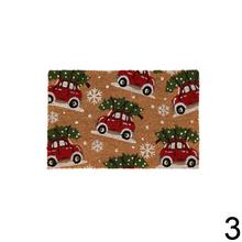 Vianočná rohož s nápisom 'Santa, Please Stop Here'.