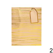 Darčeková taška s pruhovaným vzorom a zlatými detailmi.