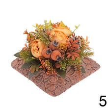 Smútočná väzba s ružovými kvetmi a zelenými listami.