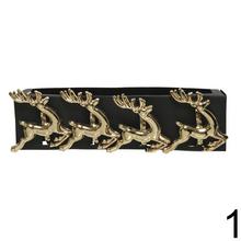 Zlaté obrúčky na servítky s motívmi soba, stromčeka a hviezdy.