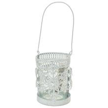 Bílý svícen ve tvaru sněhové vločky z kovu a skla.