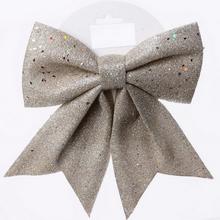 Stříbrná mašle s třpytkami.