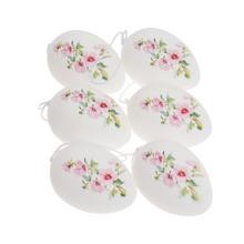 Sada plastových vajíček s květinovým vzorem v bílo-růžové barvě.