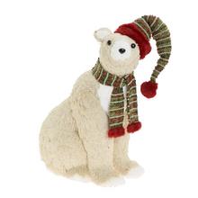 Sedící medvěd s čepicí a šálou.