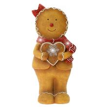 Keramický perníček se srdcem, hnědý, s červenou mašlí.