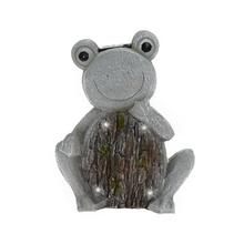 Keramická žába s usměvavou tváří a světýlky.