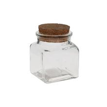 Skleněná láhev s korkovým uzávěrem, objem 80ml.