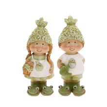 Dětské ozdoby se žabkami v zeleno-bílé barvě.