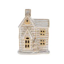 Porcelánový domek s LED osvětlením, bílé a hnědé barvy.