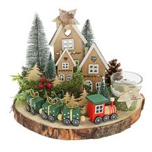 Vánoční aranžmá s dřevěnými domečky a vláčkem.