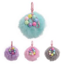 Přívěsek chlpáč v různých barvách s kuličkami.