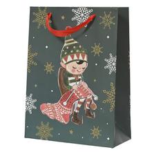 Vánoční papírová taška s obrázkem elfíka.
